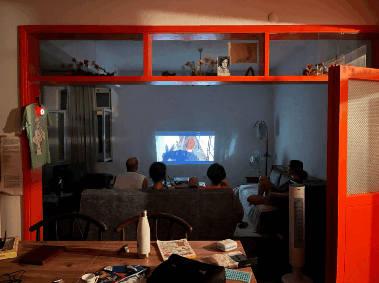 Artists watching The Man Who Fell To Earth. Courtesy of Hür Adalar